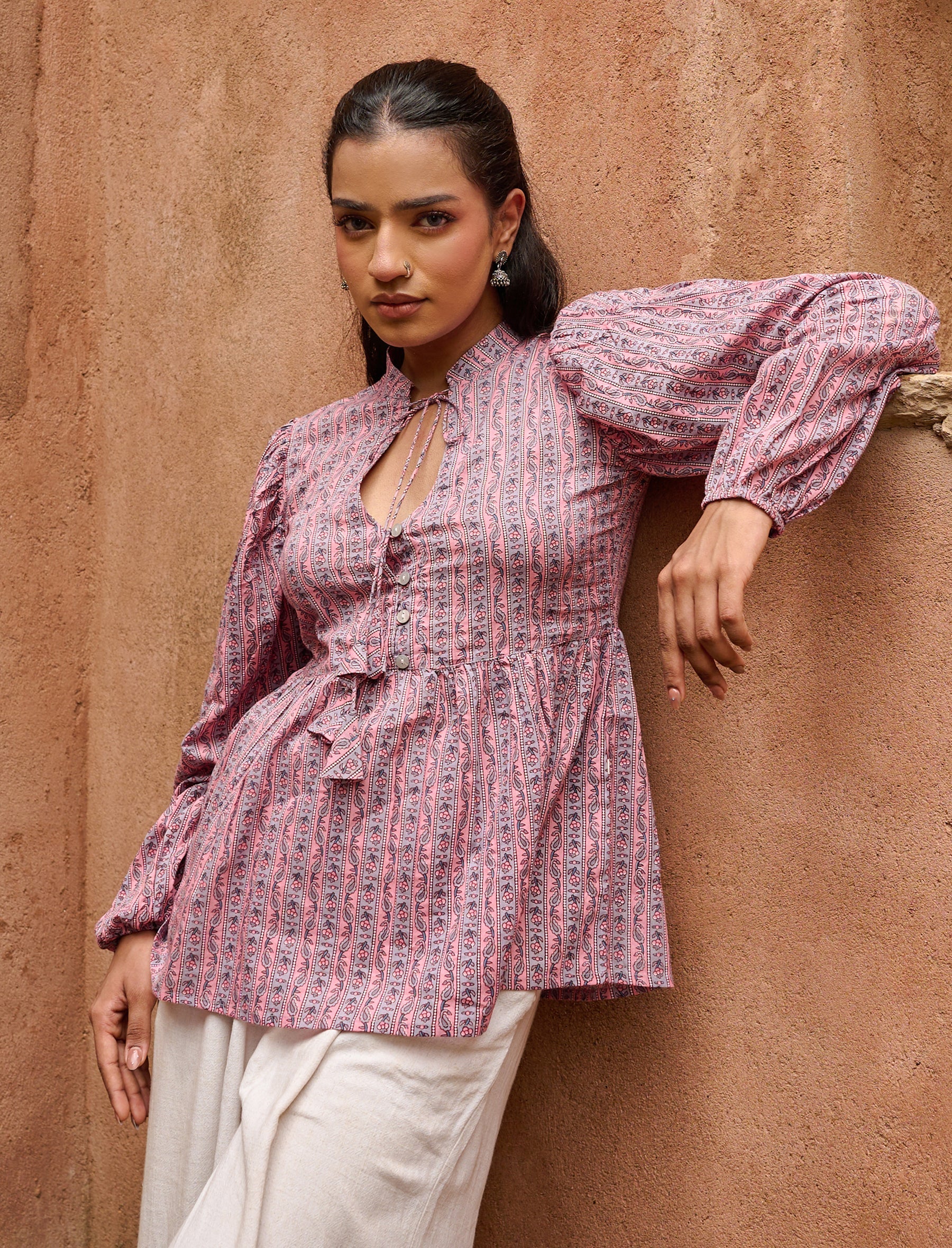 Peplum top with tie-up neckline