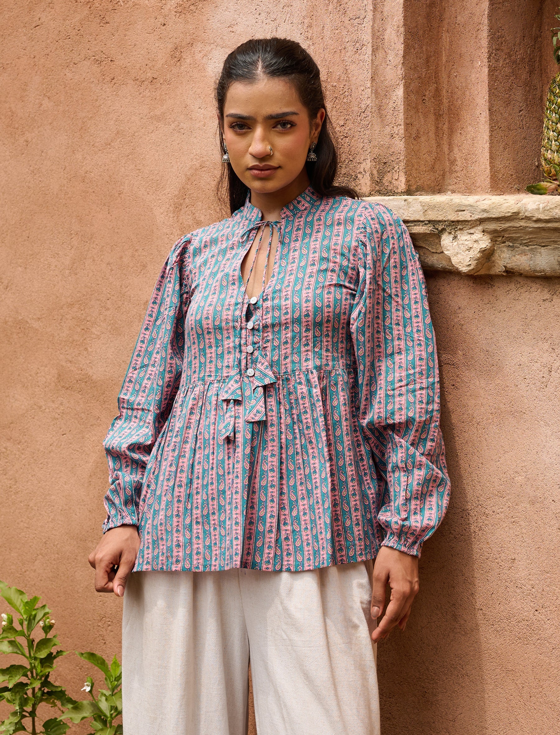 Peplum top with tie-up neckline